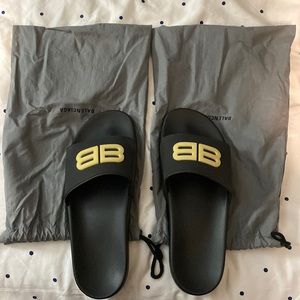 Balenciaga glow in the dark BB pool slides.